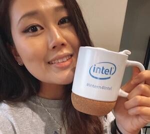 Woman holding Intel mug