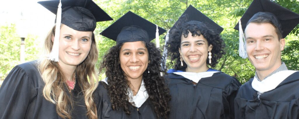 four students, all smiling